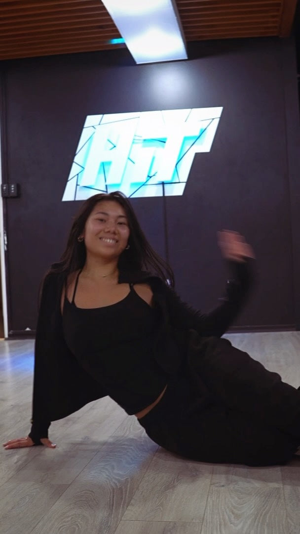 A dancer smiling during jazz funk choreography